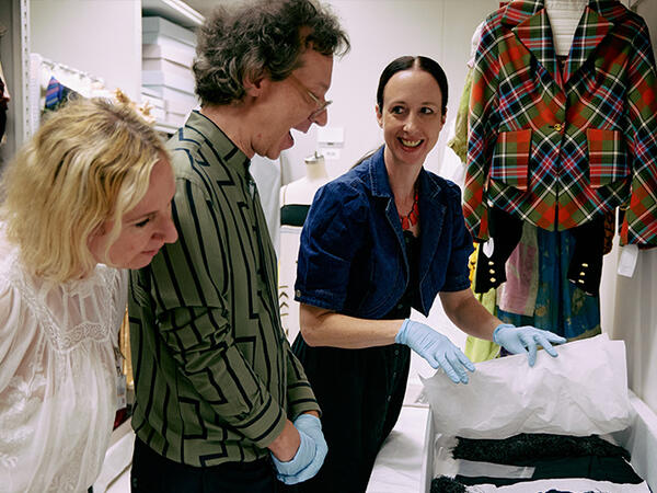 Museum visitors looking at an exhibit